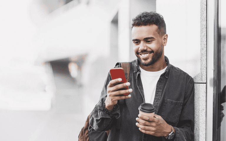 Site Search man using his cellphone